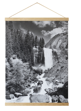 Black and white Yosemite waterfall poster hanging from a wooden frame