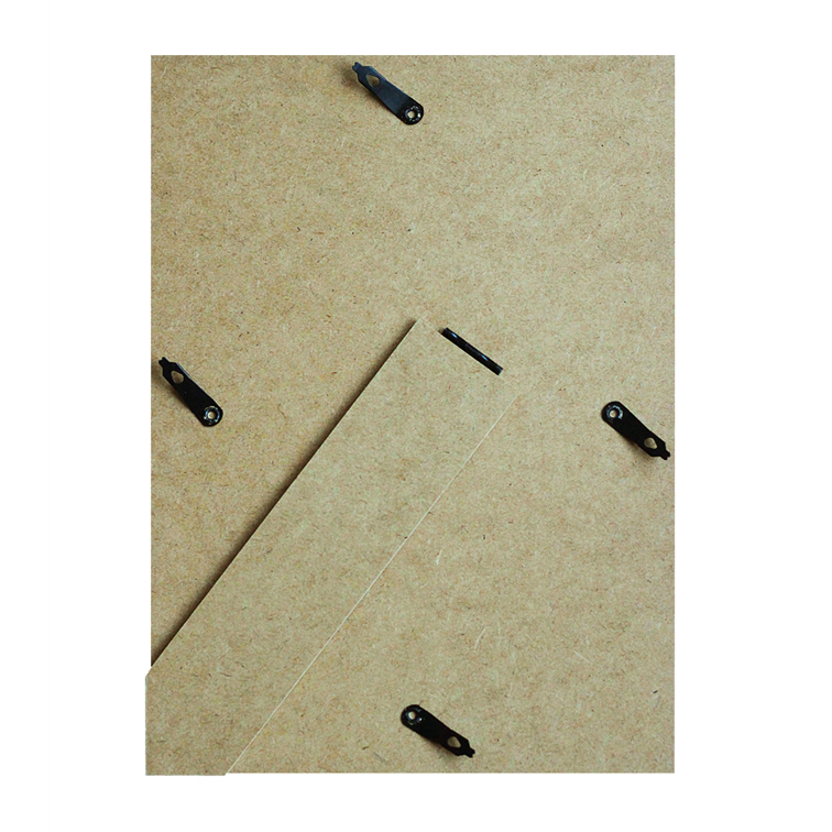 Back of a picture frame with MDF board, black swivel clips, and a folding stand