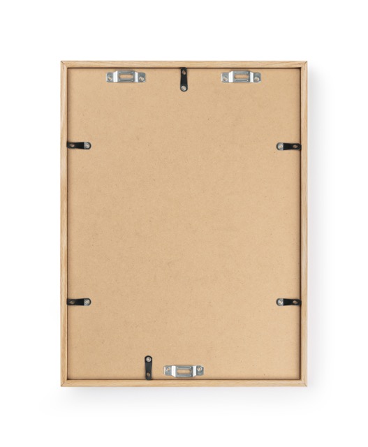 Back side of a light oak wood picture frame with metal hanging hardware